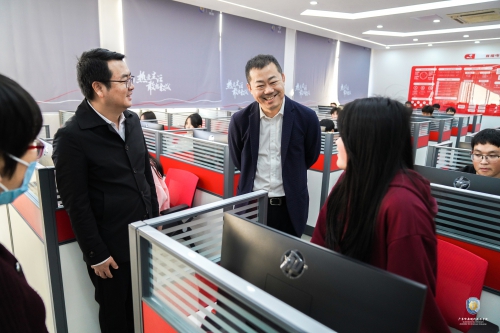 黄埔区委统战部副部长、民宗局局长谭鸿飞一行莅临我校考察调研